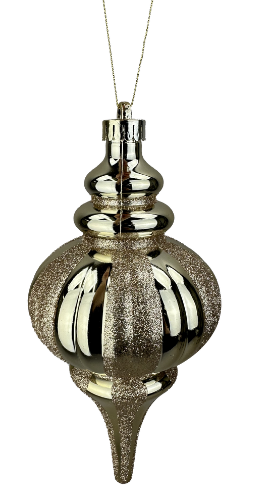 A shiny, gold-colored ornament with a pointed top and a round body, suspended against a black background.