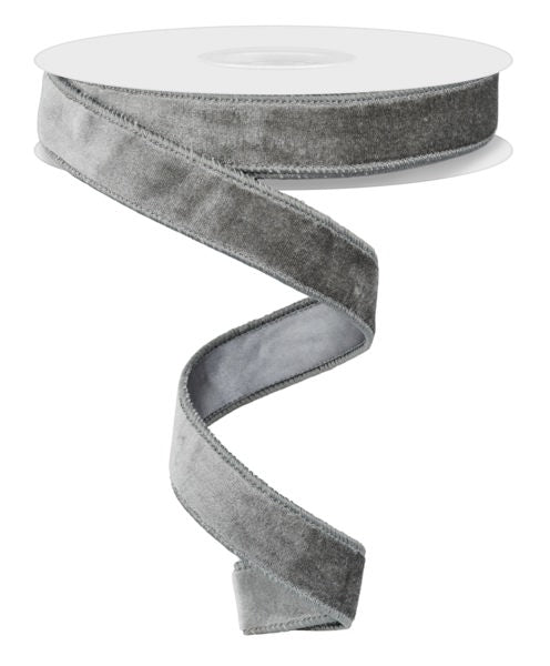 A silver-colored velvet ribbon is shown in the image, with a white spool visible at the top.