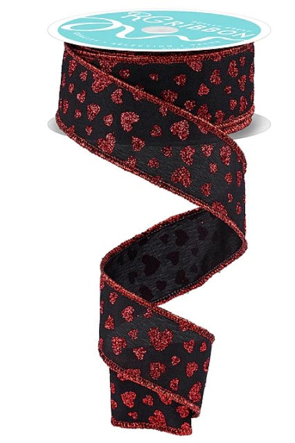 A spiral-shaped red and black heart-patterned ribbon is shown against a white background.