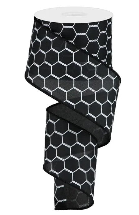 A black and white patterned ribbon with a repeating hexagonal design.