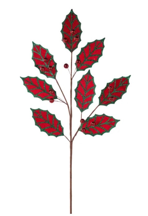 A branch with red leaves and red berries, resembling a holly plant.