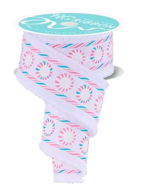 A roll of ribbon with a repeating pattern of pink and blue circles on a white background.