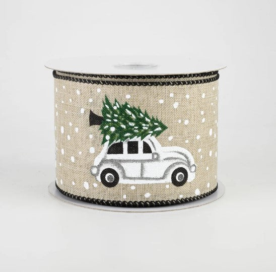 a white car with a christmas tree on top of it