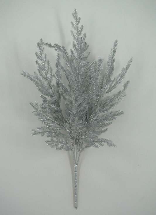 A silver-colored artificial plant or branch with multiple thin, pointed leaves arranged in a cluster.