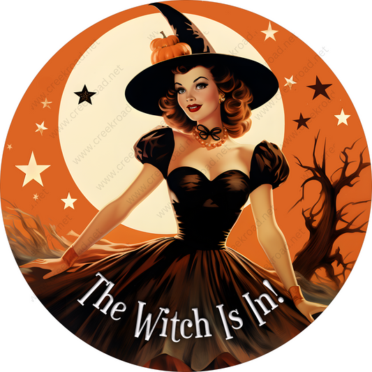 a picture of a woman in a witch costume