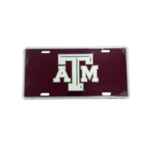 A maroon license plate with the letters 'ATM' prominently displayed in the center.