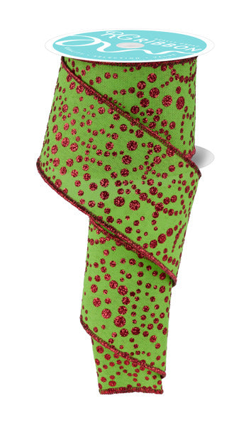 A green and red polka dot ribbon is shown, with a white label attached to it.