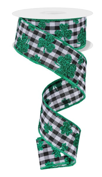 a black and white checkered ribbon with shamrocks on it