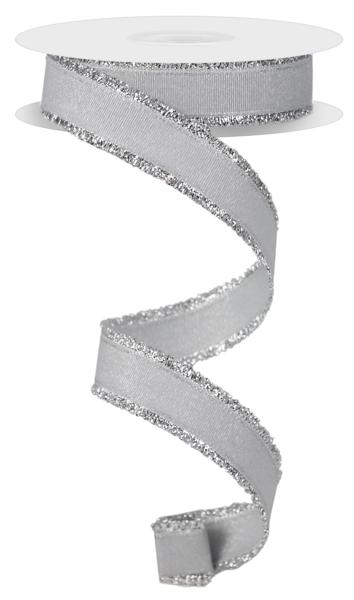 a roll of silver glitter ribbon on a white background