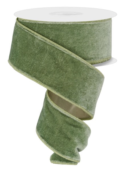 a roll of green felt tape on a white background