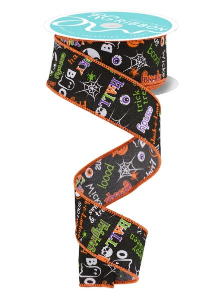 a spool of halloween ribbon on a white background