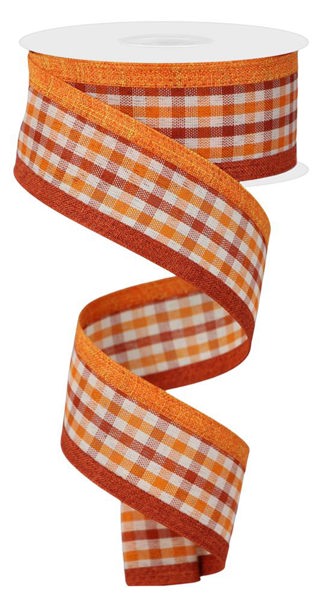 a roll of orange and white checkered ribbon