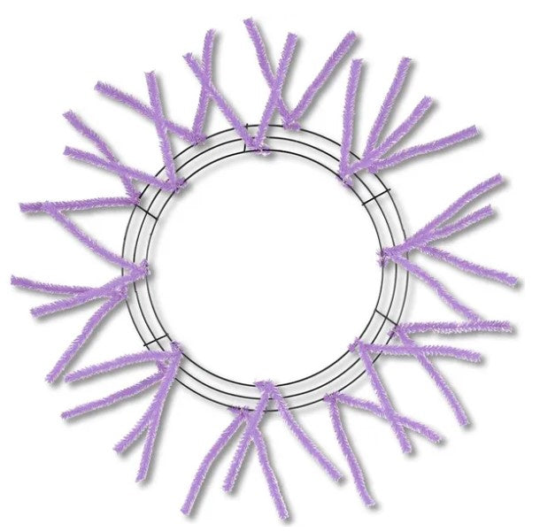 A circular wreath made of purple pipe cleaners arranged in a radial pattern.