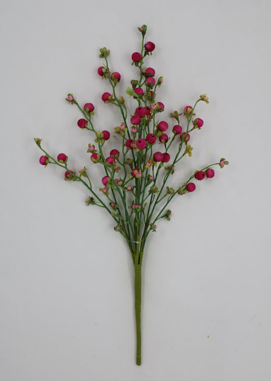 A bouquet of small pink flowers with green stems is displayed against a white background.