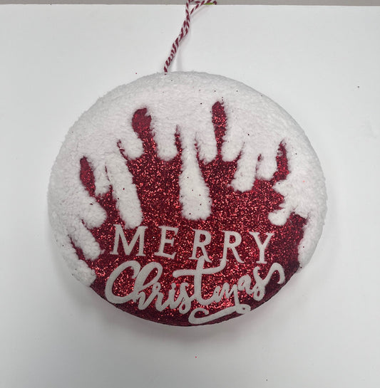 a merry christmas ornament hanging on a wall