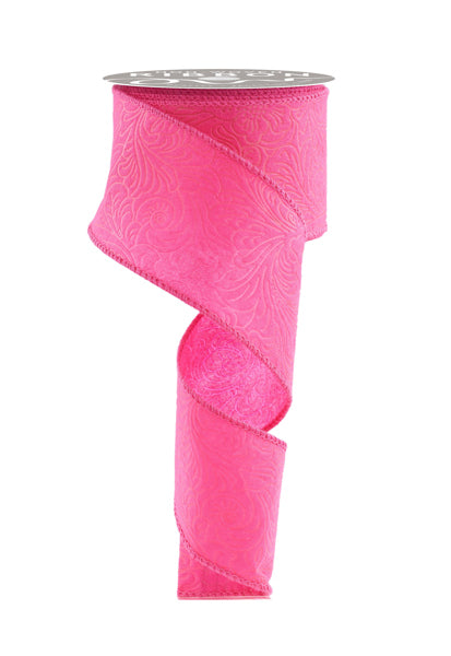 a roll of pink ribbon on a white background