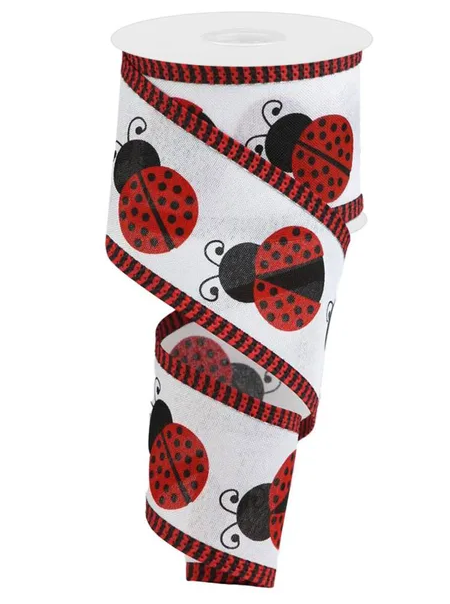 A white ribbon with a repeating pattern of red and black ladybug designs.