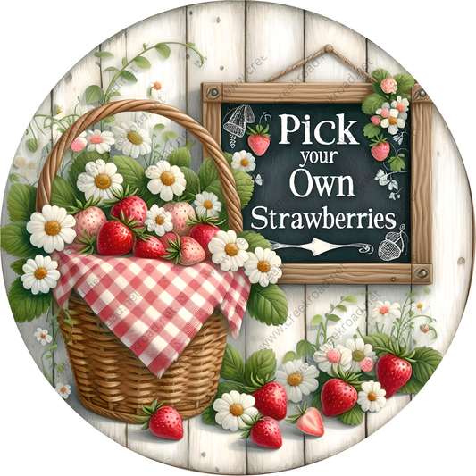A basket filled with fresh strawberries sits next to a chalkboard sign that reads "Pick your own strawberries", surrounded by a variety of flowers and leaves.
