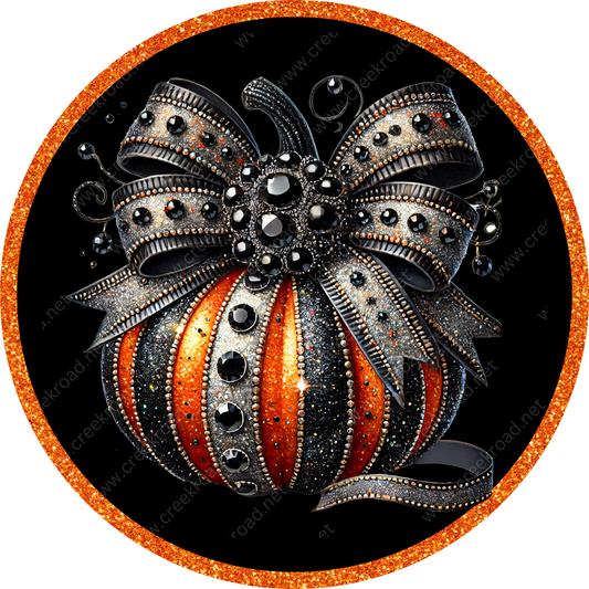 a painting of a pumpkin with a bow on it