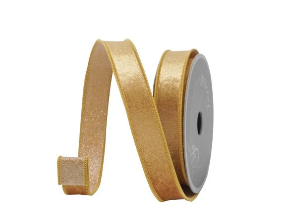 A gold glittery ribbon is coiled and lying on its side against a white background.