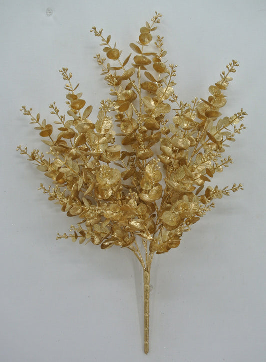a golden floral arrangement with numerous small leaves and branches, creating a visually striking and elegant display.