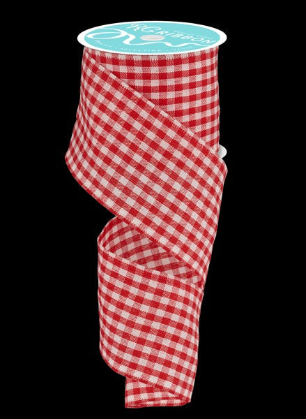 a roll of red and white checkered ribbon