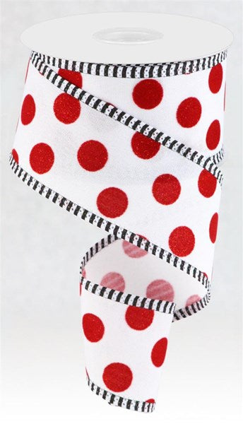 a roll of toilet paper with red and white polka dots on it