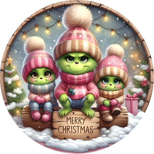 a christmas card with three small green monsters