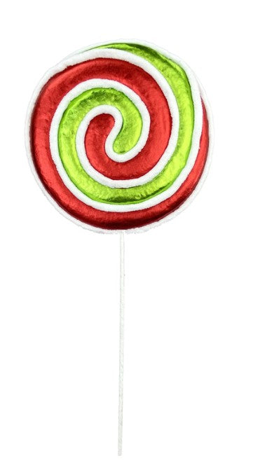 a green and red lollipop on a stick