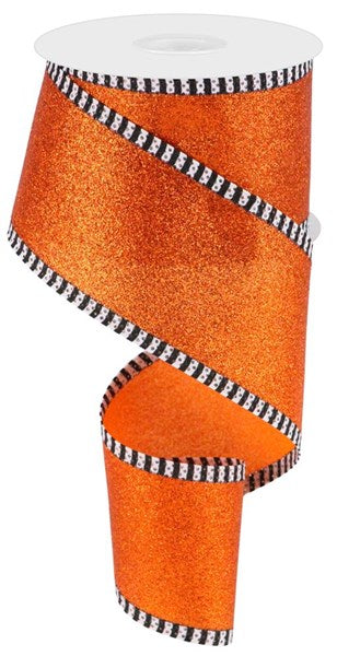 an orange ribbon with black and white stripes