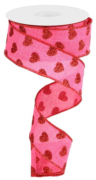 a pink ribbon with hearts on it