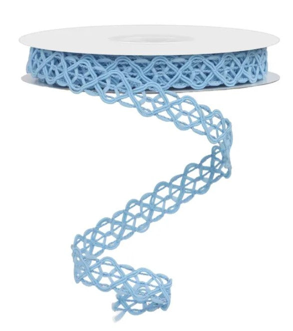 A spool of blue, knotted ribbon with a delicate, intricate pattern.