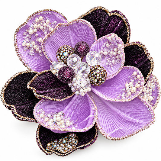 a large, intricately designed purple flower adorned with numerous jewels and pearls.
