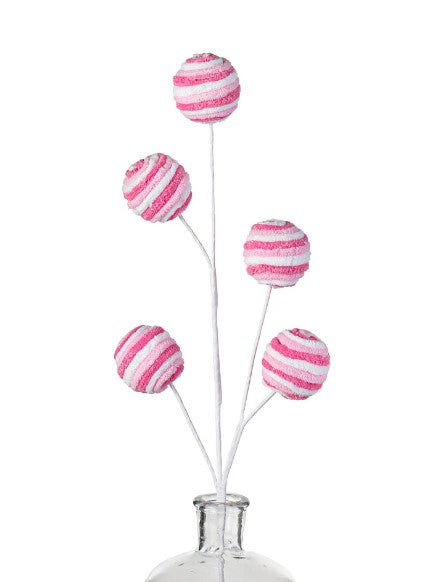 pink and white striped lollipops in a vase