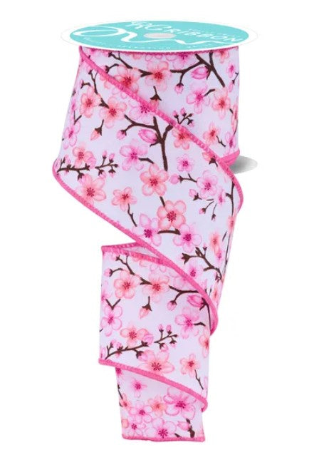 A pink and white floral patterned ribbon is shown, with the ribbon appearing to be made of a soft, silky material.