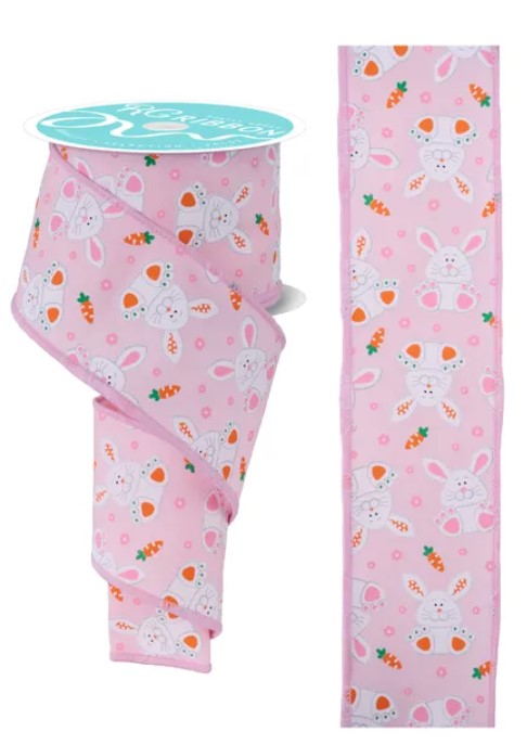 a pink ribbon with a repeating pattern of white rabbits and carrots.