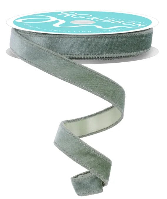 A roll of green velvet ribbon with a white label.