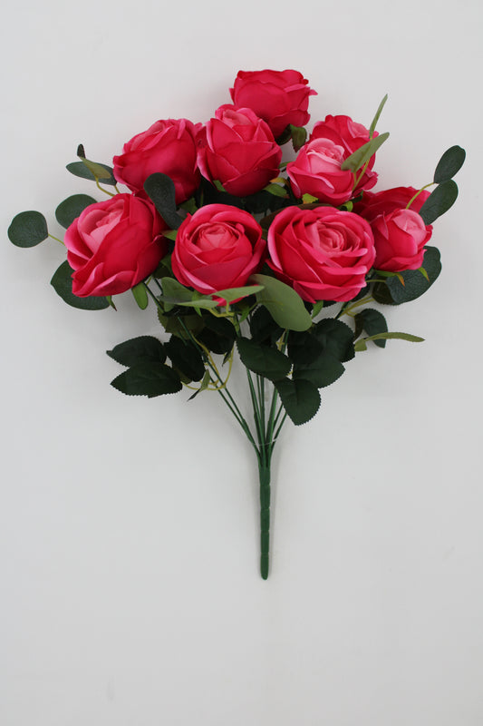 A bouquet of vibrant red roses with green leaves is displayed against a plain white background.