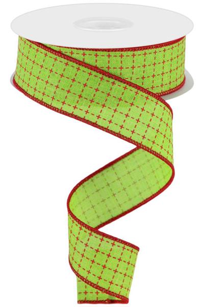 a roll of green and red ribbon on a white background