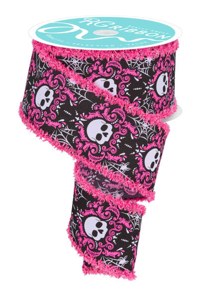 a roll of pink and black ribbon with skulls on it