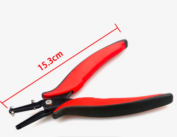 a pair of red and black scissors on a white background