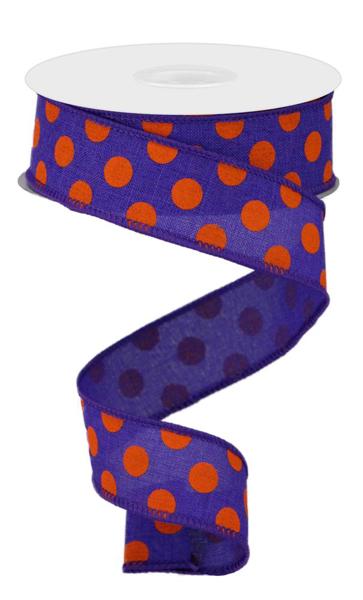 a roll of purple and orange polka dot ribbon