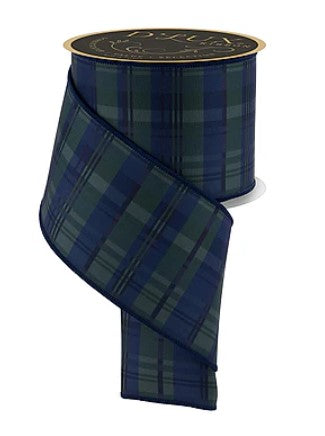 A roll of blue and green plaid ribbon with a gold-colored top.