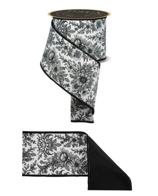 a black and white floral pattern on a ribbon, with a black and white floral pattern on a black background.