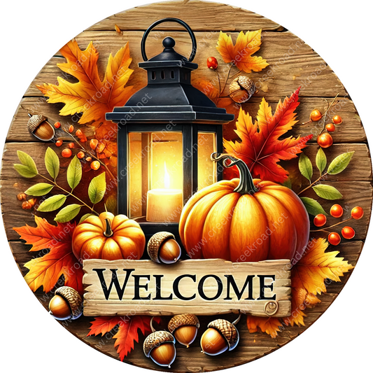 A wooden lantern with a lit candle, surrounded by autumn leaves, pumpkins, and acorns, with a "Welcome" sign below.