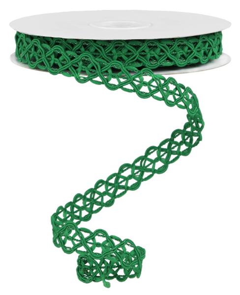 a roll of green ribbon on a white background