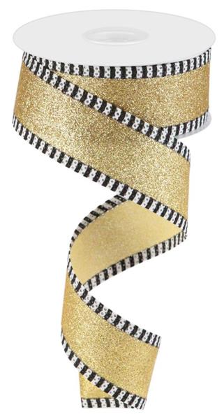 a roll of gold glitter ribbon with black and white stripes