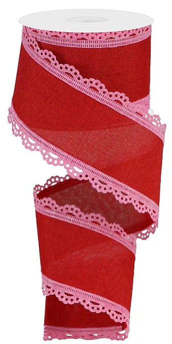 A red ribbon with pink lace trim, which appears to be a decorative item.