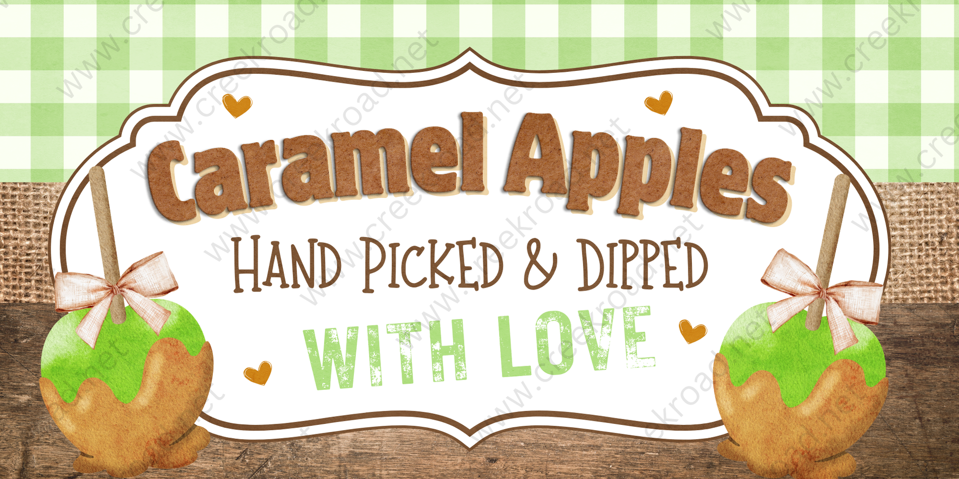 a sign for "Caramel Apples" that reads "Hand Picked & Dipped with Love". The sign is set against a green and white checkered background, and there are two caramel apples on either side of the sign, each with a bow on top.
