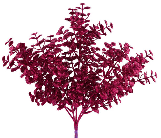 A vibrant, purple-colored artificial tree with numerous small leaves and branches.
